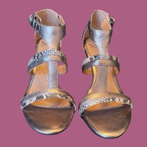 Great looking sandal with snake skin and metallic colors.